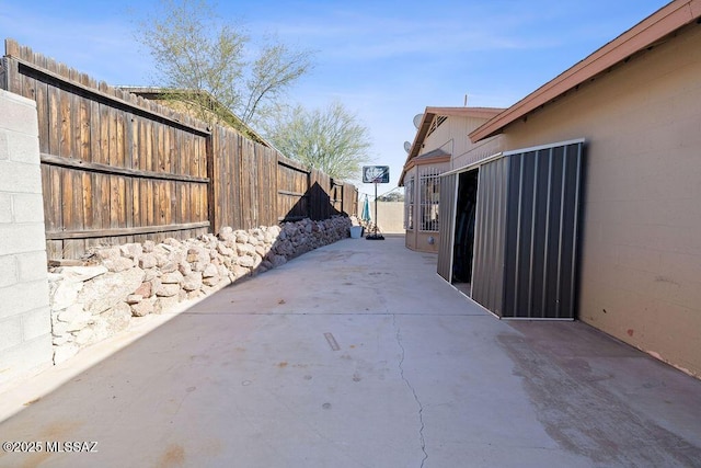 view of property exterior with a patio