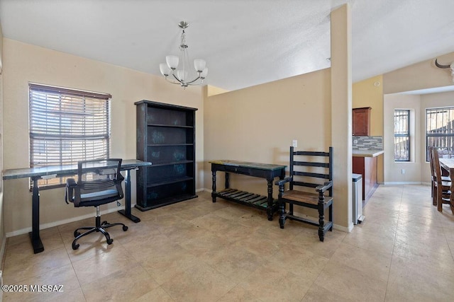 office area with a healthy amount of sunlight and a notable chandelier