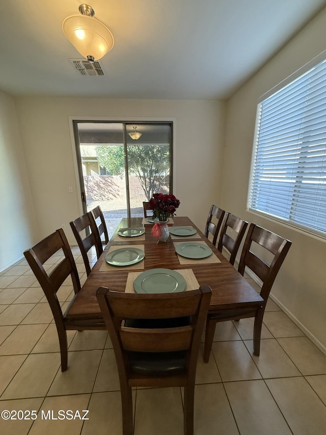 dining space with light tile patterned flooring