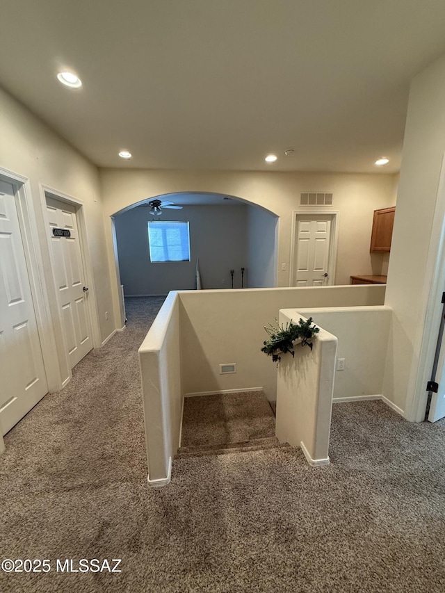 corridor with carpet floors