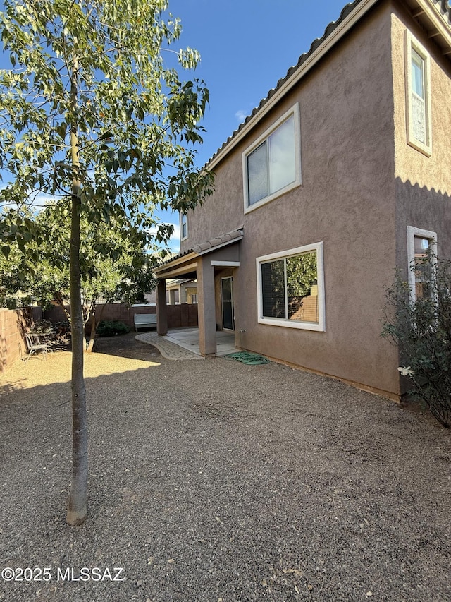 back of house with a patio area