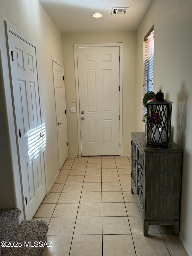 entryway featuring light tile patterned floors