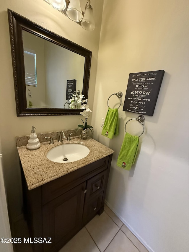 bathroom featuring tile patterned flooring and vanity