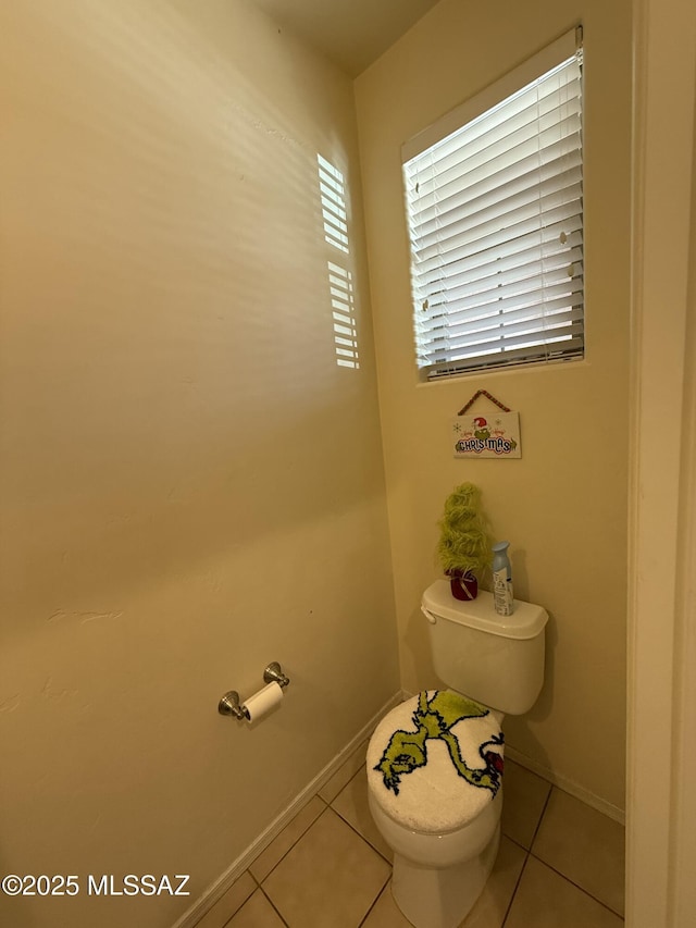 bathroom featuring toilet and tile patterned floors