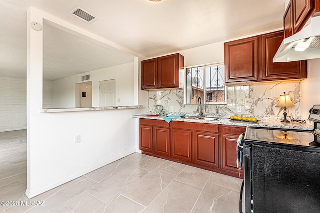 kitchen featuring light stone countertops, sink, electric range, and decorative backsplash