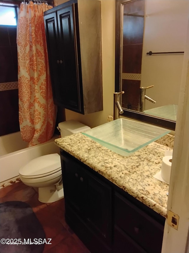 full bathroom featuring toilet, vanity, and shower / bath combo with shower curtain