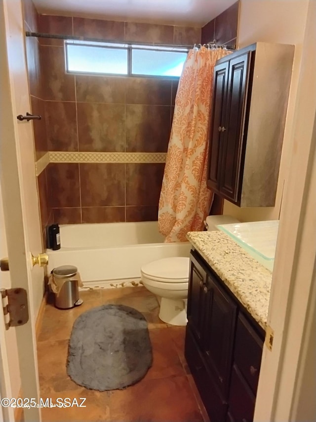 full bathroom featuring toilet, vanity, tile patterned flooring, and shower / tub combo