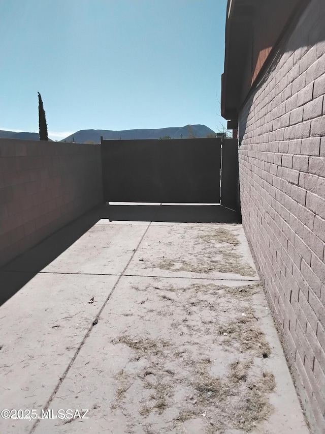 view of patio / terrace featuring a mountain view