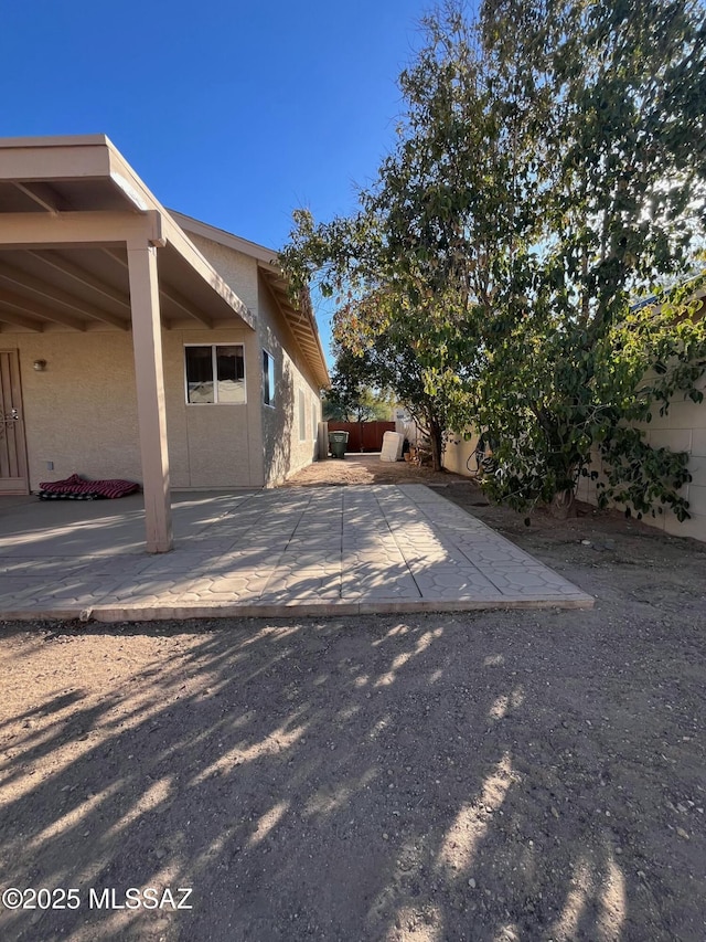 view of patio / terrace featuring fence