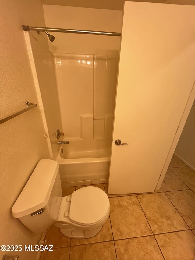 full bath featuring tile patterned flooring, toilet, and shower / tub combination