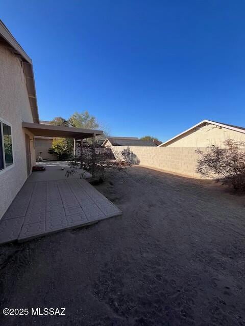 view of yard with a patio area and a fenced backyard