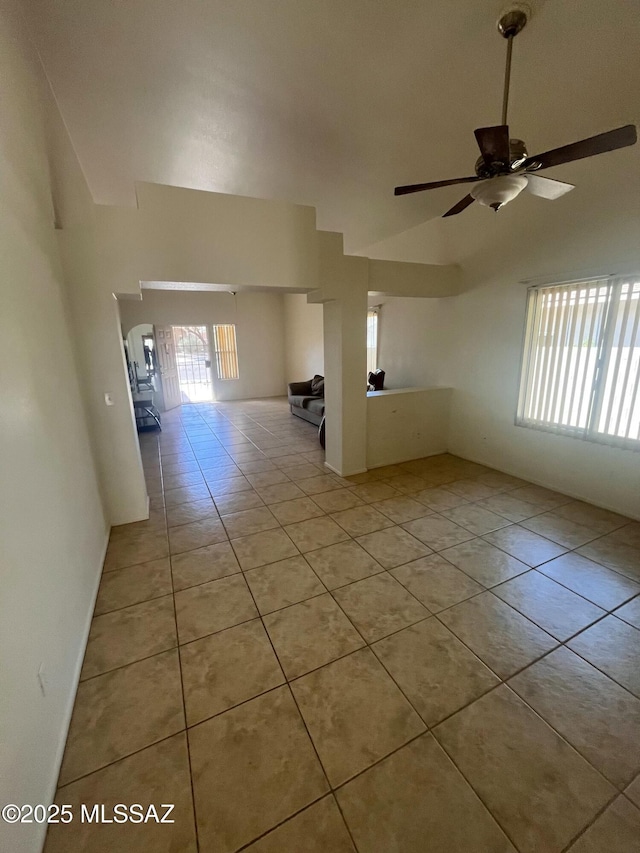 spare room with light tile patterned floors and a ceiling fan