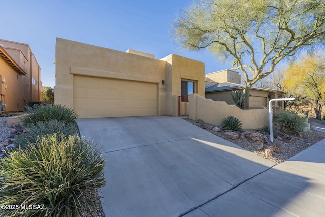 southwest-style home with a garage