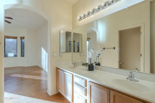 bathroom with ceiling fan, tile patterned floors, and vanity