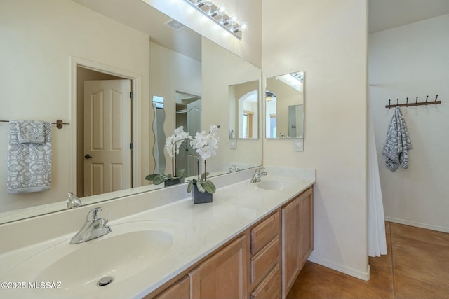 bathroom with vanity and tile patterned floors