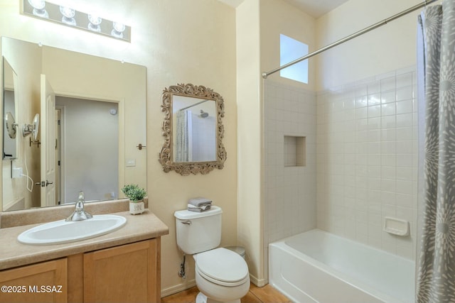 full bathroom with vanity, shower / bath combo, and toilet