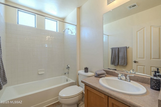 full bathroom featuring washtub / shower combination, vanity, and toilet