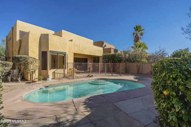 view of swimming pool with a patio