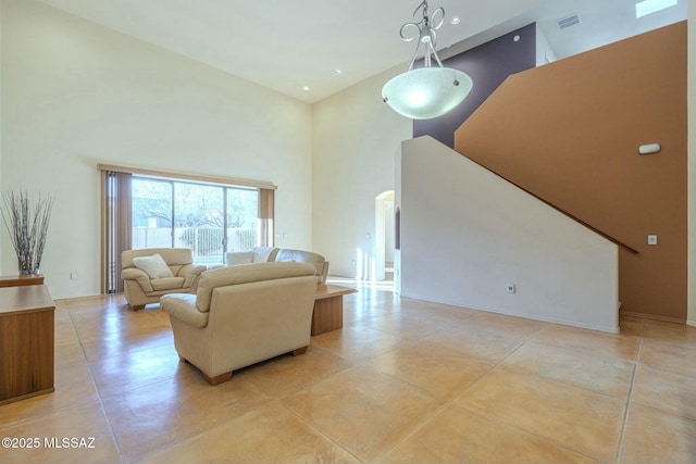 living room with a high ceiling