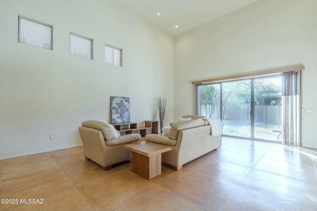 living room with a high ceiling