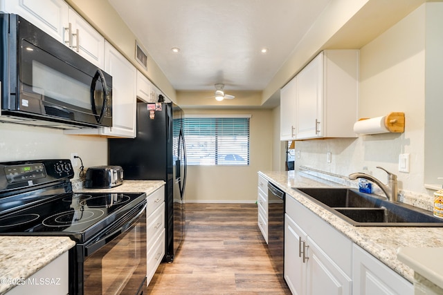 kitchen featuring black appliances, a sink, white cabinetry, and a ceiling fan