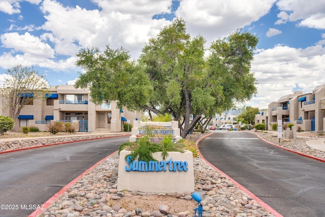 view of street featuring sidewalks, a residential view, and curbs