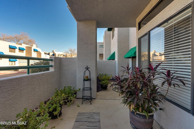 view of patio / terrace with a balcony