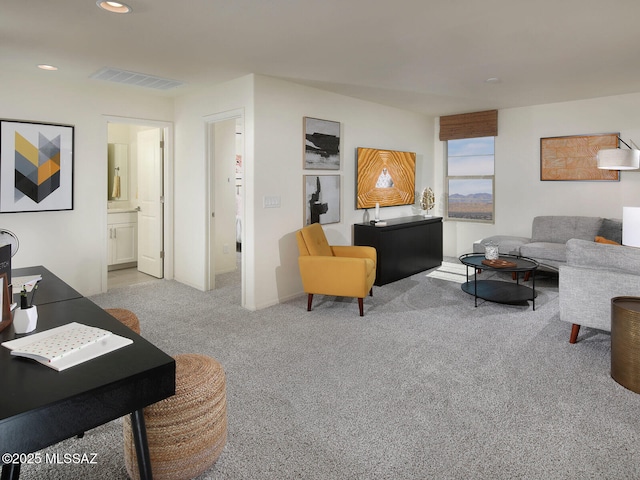 living room featuring carpet flooring, visible vents, and recessed lighting