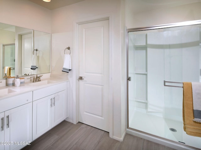 full bath featuring a sink and a stall shower