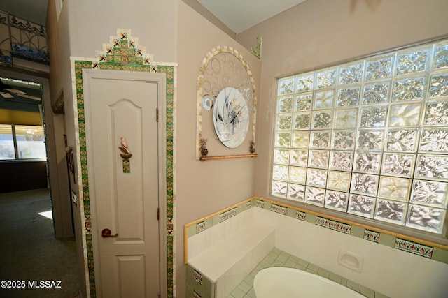 bathroom featuring a washtub