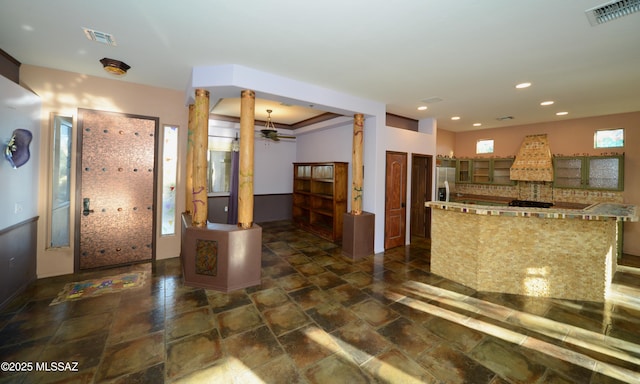 kitchen with stainless steel fridge with ice dispenser and a center island