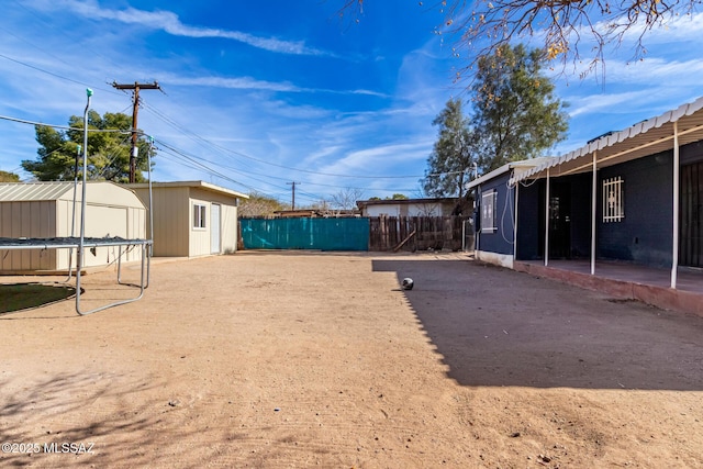 view of yard featuring a storage shed