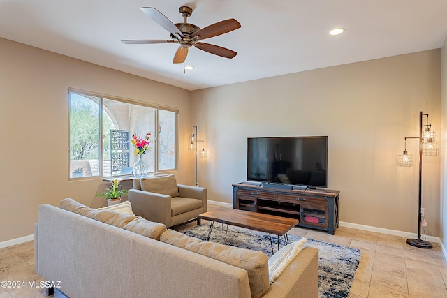 living room featuring ceiling fan and light tile patterned floors