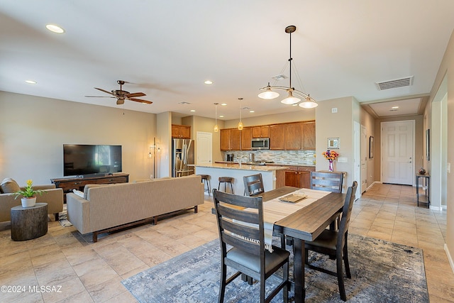 dining room featuring light tile patterned floors and ceiling fan