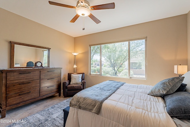 bedroom featuring ceiling fan and light tile patterned floors