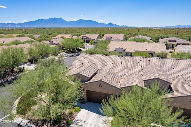 birds eye view of property with a mountain view