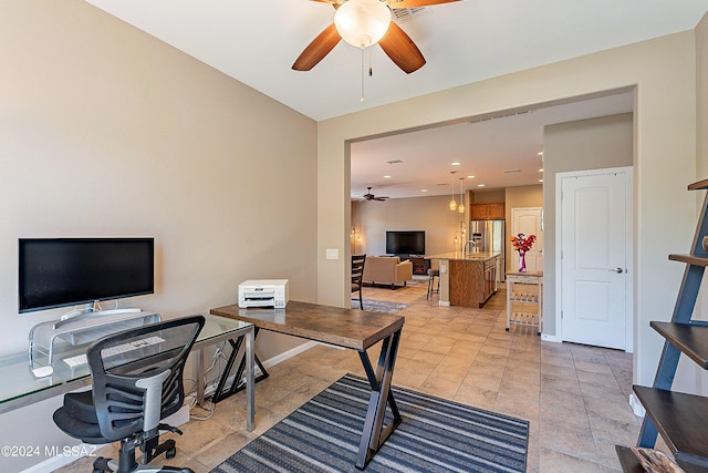 office space with ceiling fan and light tile patterned flooring