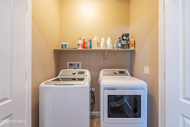 laundry area with washing machine and dryer