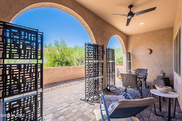 view of patio / terrace featuring ceiling fan