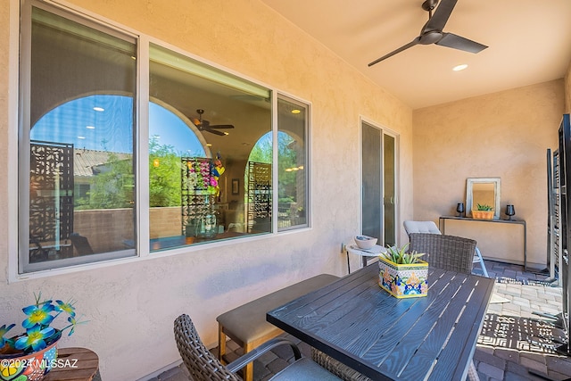 view of patio / terrace featuring ceiling fan