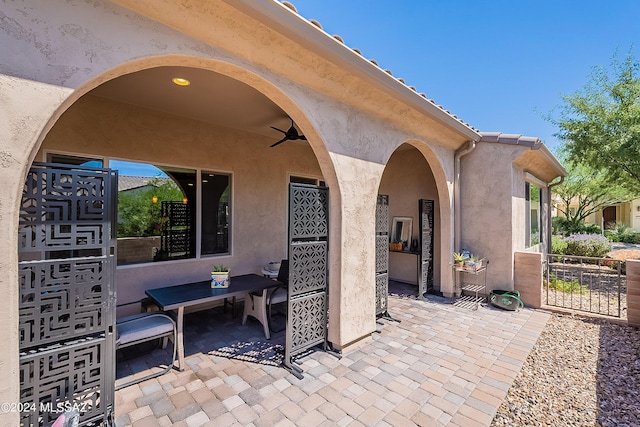 view of patio featuring ceiling fan