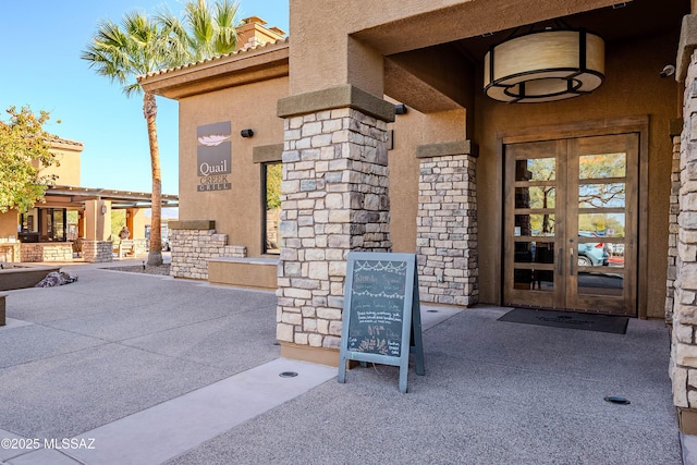 property entrance featuring french doors