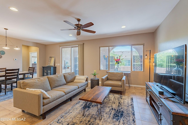 tiled living room with ceiling fan