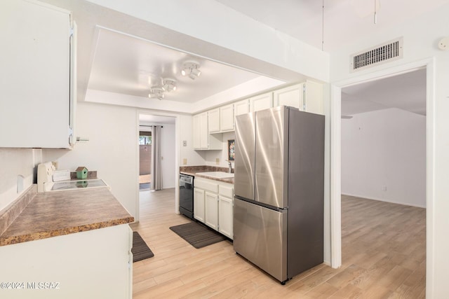 kitchen featuring stainless steel fridge, black dishwasher, stove, light hardwood / wood-style floors, and white cabinets