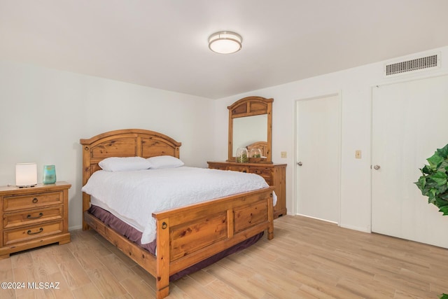 bedroom with light wood-type flooring