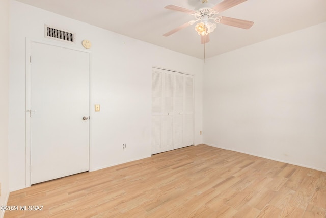 unfurnished bedroom with light wood-type flooring and ceiling fan