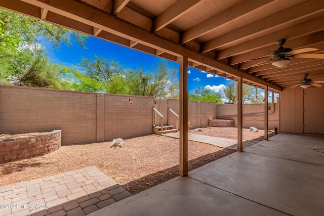 view of patio featuring ceiling fan