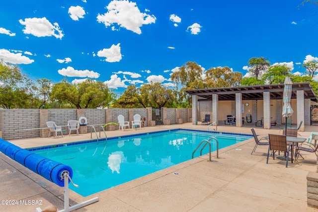 view of swimming pool featuring a patio area