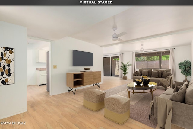 living room featuring ceiling fan and light wood-type flooring