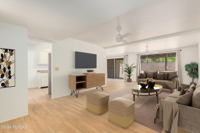 living room with ceiling fan and light hardwood / wood-style flooring